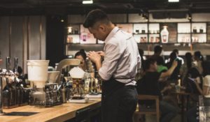 worker pouring coffee